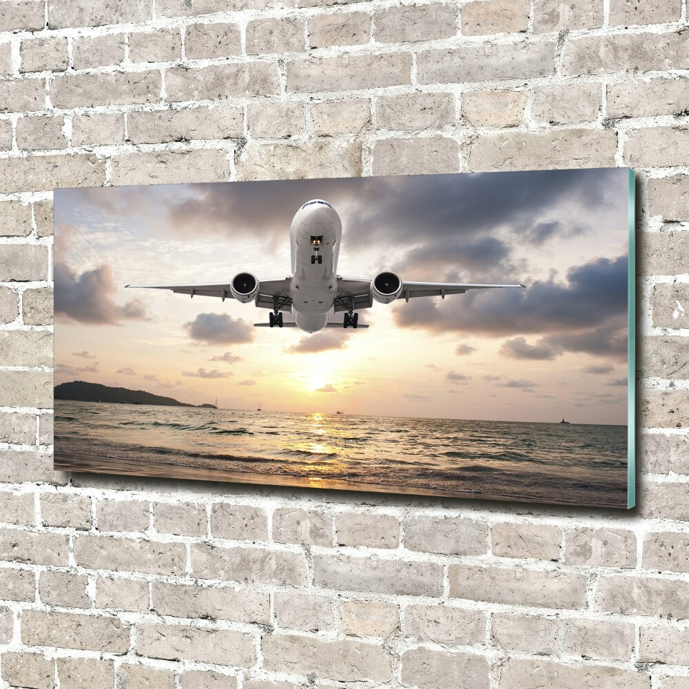Üvegkép falra Repülőgép a tenger felett