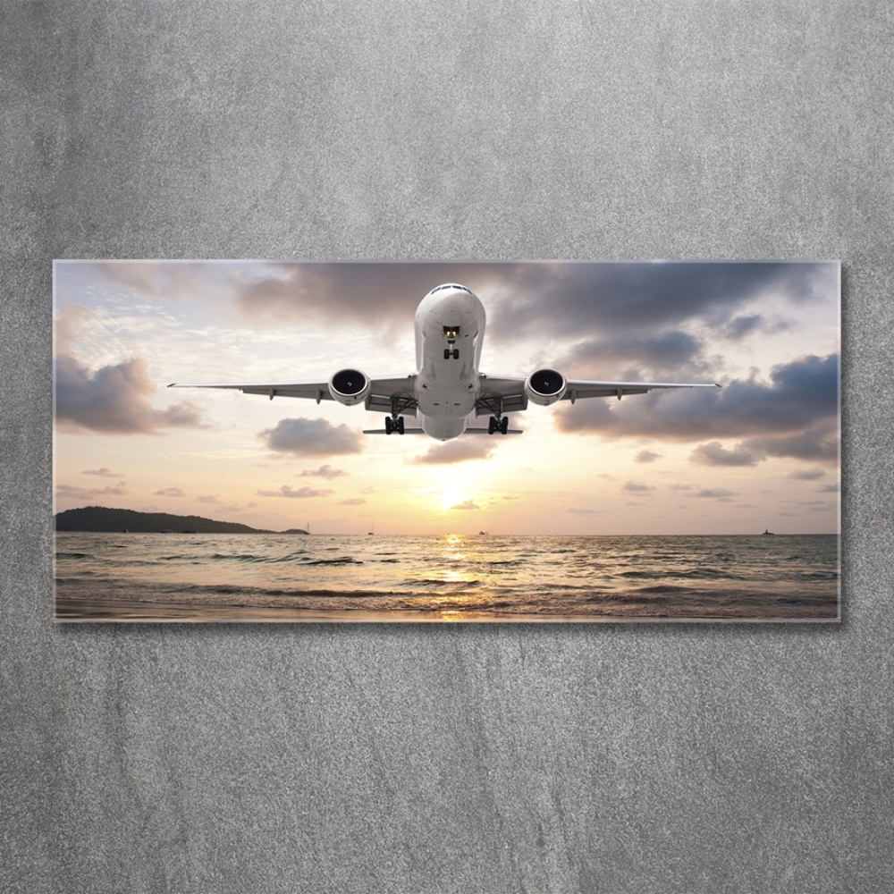 Üvegkép falra Repülőgép a tenger felett