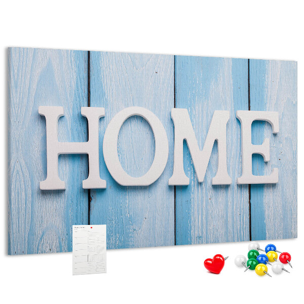 Színes parafatábla Stílusos HOME felirat kék háttérrel.