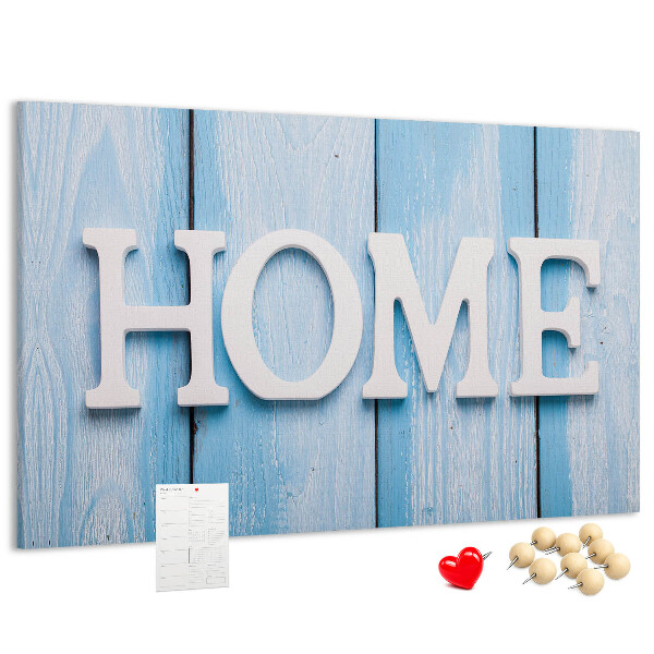 Színes parafatábla Stílusos HOME felirat kék háttérrel.